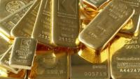 Oro sube por debilidad del dólar, pero alza de acciones contienen ganancias